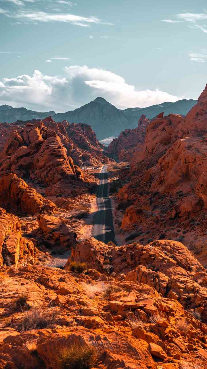 Winding road through the vibrant red rock formations of Valley of Fire State Park, Nevada | 4k picture - MirrorLog